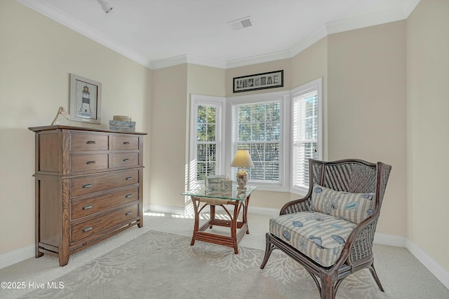 living area with ornamental molding and light carpet