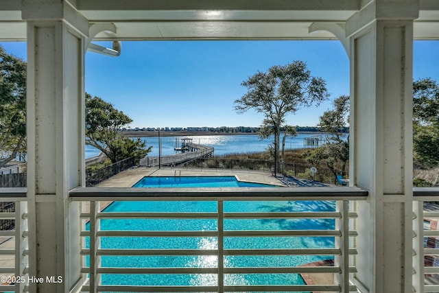 view of pool featuring a water view