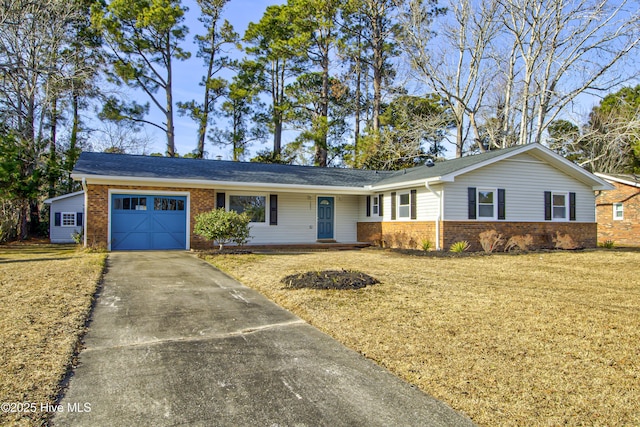 single story home with a garage and a front yard