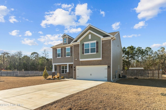 view of front of property featuring a garage and central air condition unit