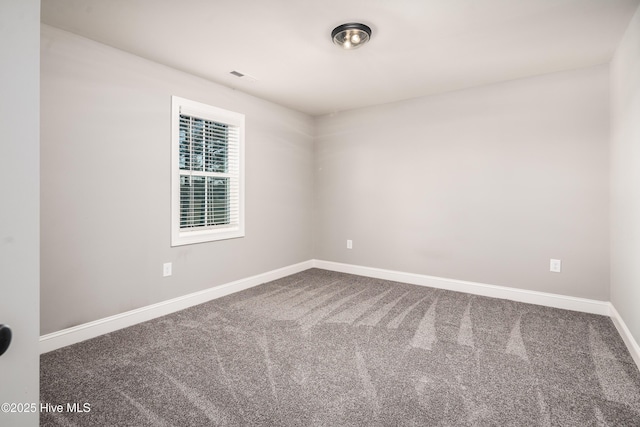 spare room with carpet flooring