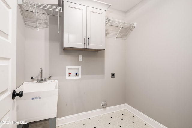 laundry room featuring washer hookup, sink, cabinets, and hookup for an electric dryer