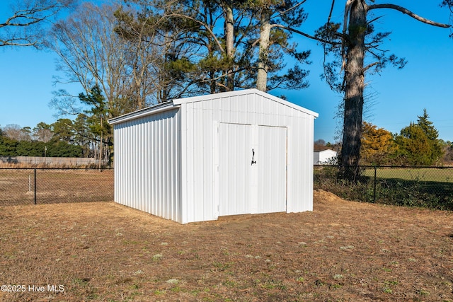 view of outbuilding with a lawn