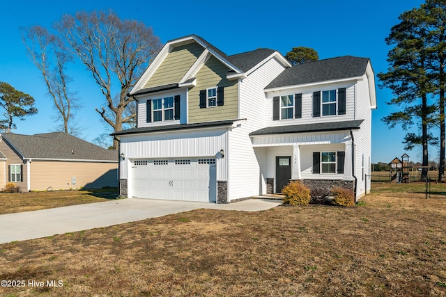 craftsman house featuring a garage and a front yard