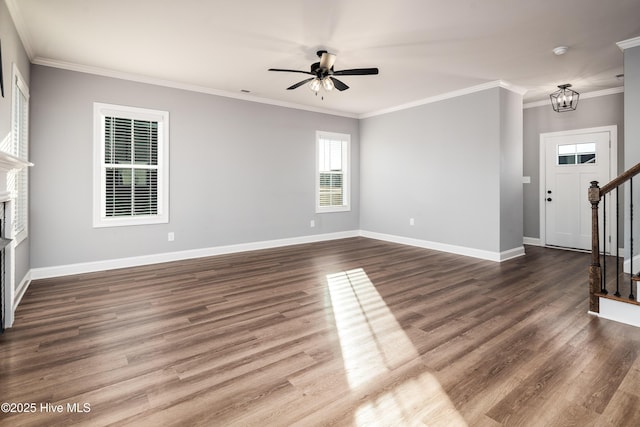 unfurnished living room featuring crown molding, ceiling fan with notable chandelier, and hardwood / wood-style floors