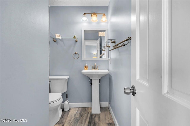 bathroom featuring sink and toilet