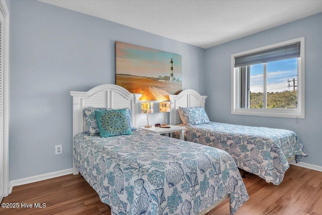 bedroom with hardwood / wood-style floors