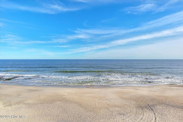 view of water feature with a beach view