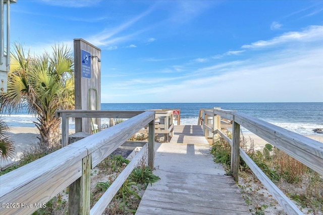 view of property's community with a view of the beach and a water view