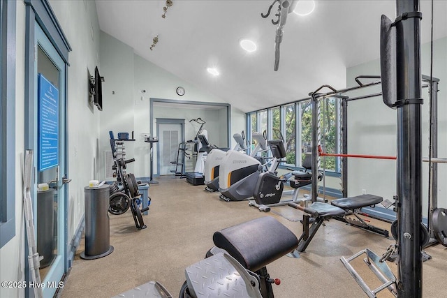 exercise room with lofted ceiling