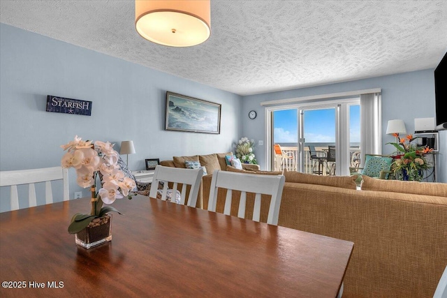 dining area with a textured ceiling