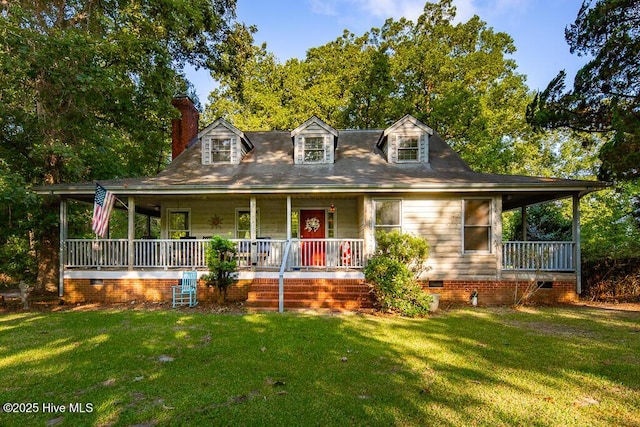 view of front of home with covered porch and a front lawn