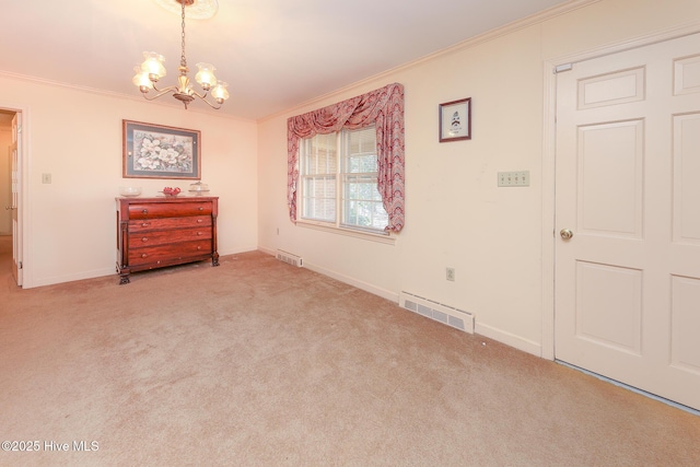 empty room with a chandelier, light colored carpet, and crown molding