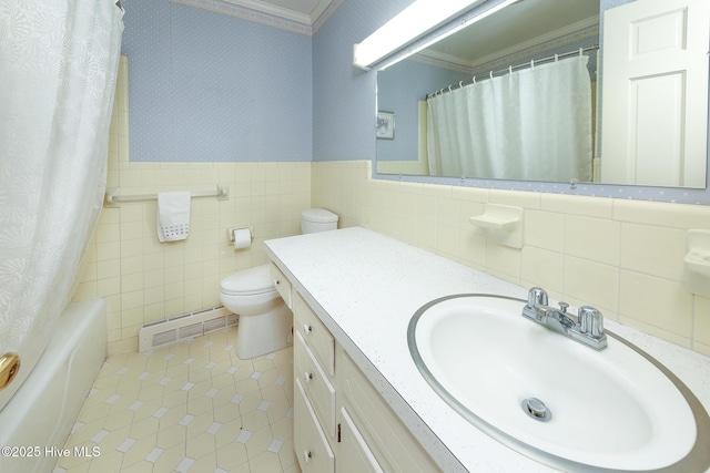 full bathroom featuring tile patterned flooring, toilet, crown molding, and tile walls