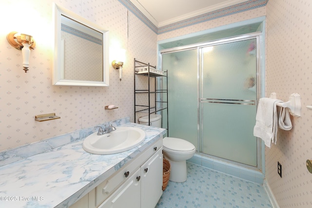 bathroom with walk in shower, toilet, vanity, and ornamental molding