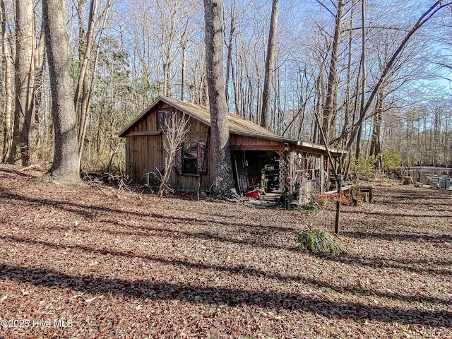 view of property exterior with an outbuilding