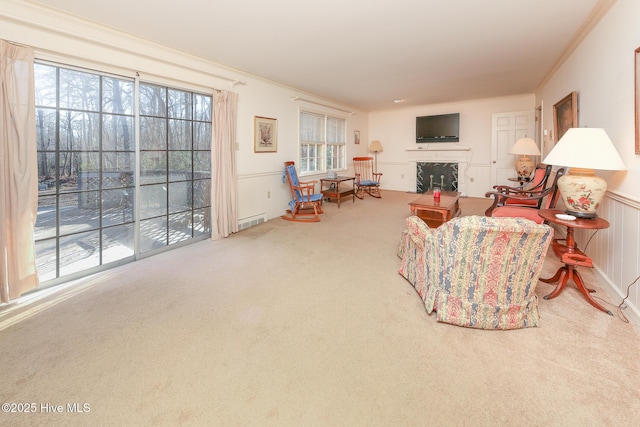 carpeted living room with crown molding