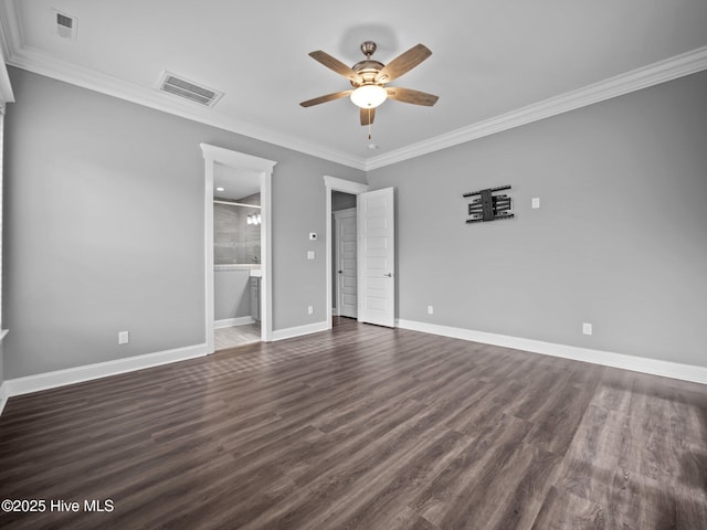 unfurnished room featuring crown molding and dark wood-type flooring