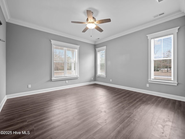 unfurnished room with ornamental molding, dark hardwood / wood-style flooring, and a healthy amount of sunlight