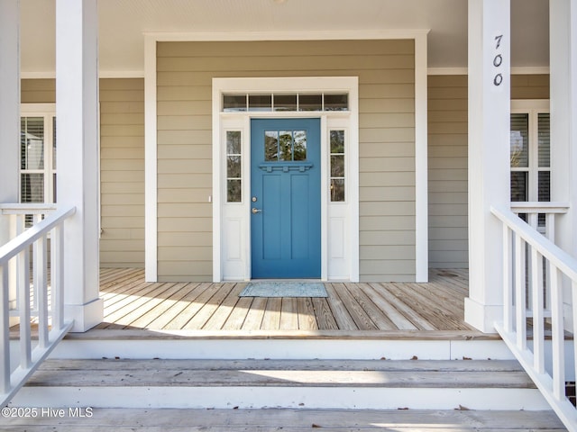 entrance to property featuring a porch