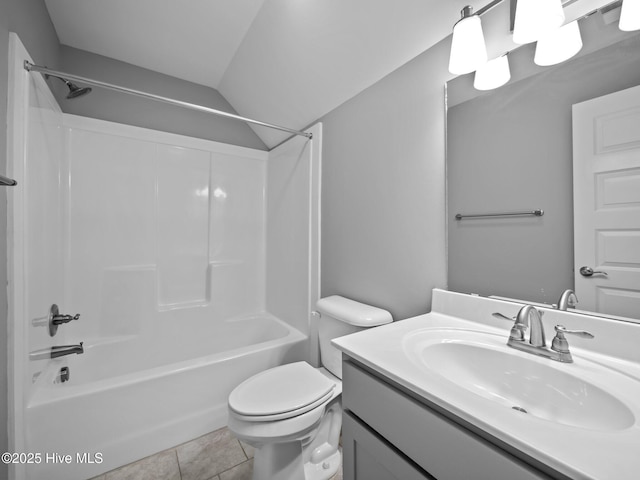 full bathroom featuring vanity, tile patterned floors, washtub / shower combination, vaulted ceiling, and toilet