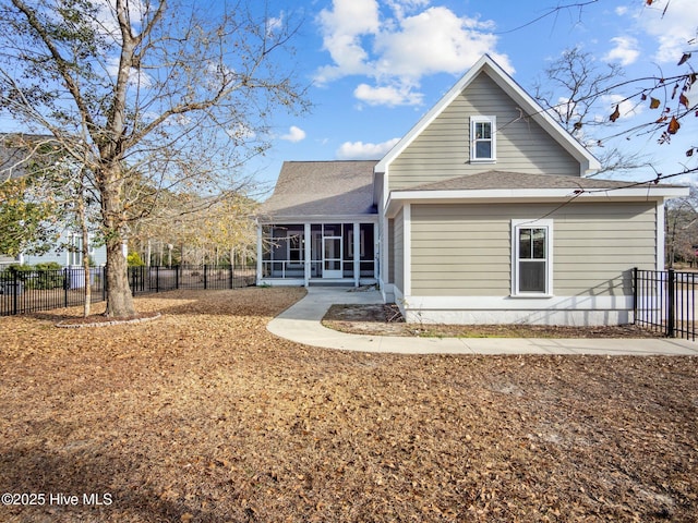 back of house featuring a sunroom