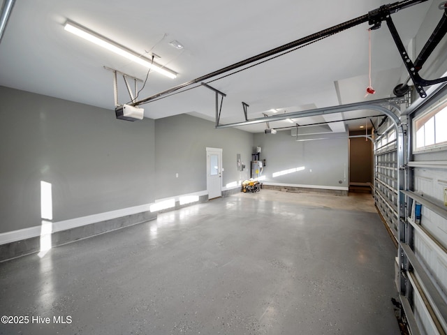 garage featuring a garage door opener and water heater