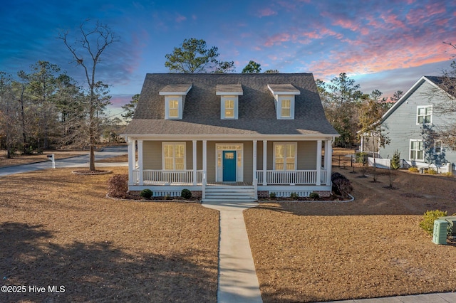 view of front of property featuring covered porch