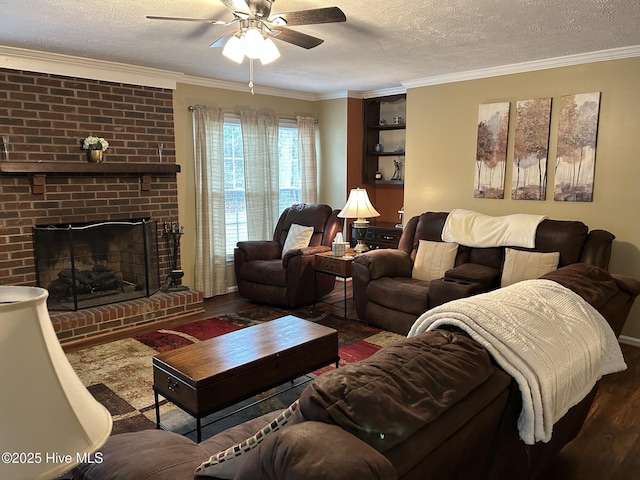 living room featuring ceiling fan, hardwood / wood-style floors, a textured ceiling, and ornamental molding