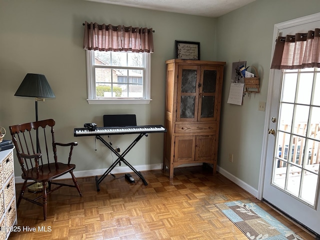 sitting room featuring light parquet flooring