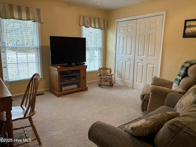 living room with carpet floors and ceiling fan