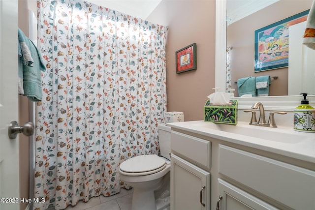 bathroom featuring tile patterned flooring, vanity, a shower with shower curtain, and toilet