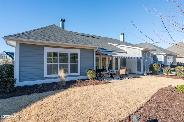 rear view of house featuring a patio