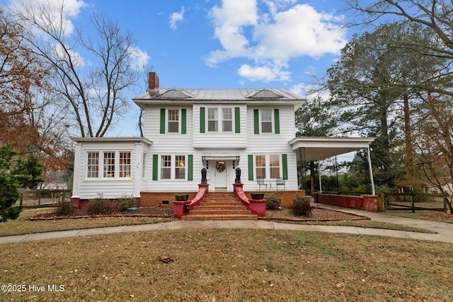 view of front of home featuring a carport