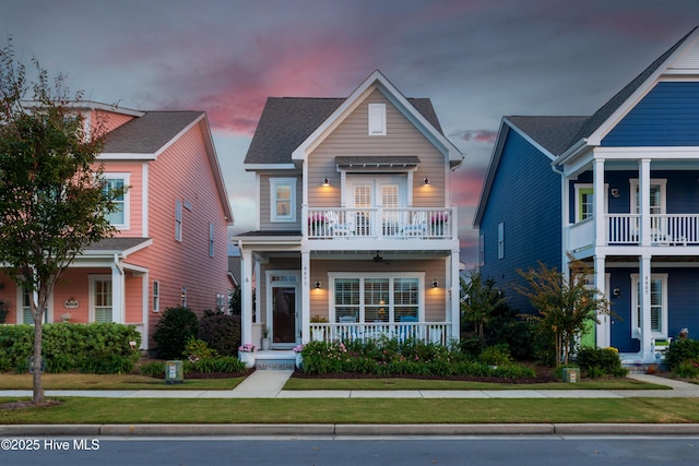 view of front of house featuring a porch and a balcony