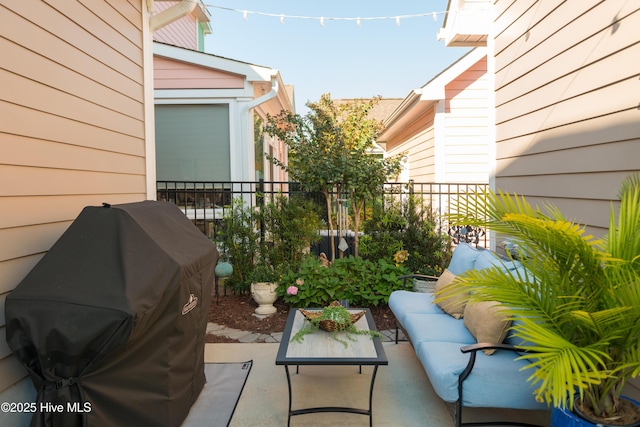 balcony featuring a patio area, grilling area, and an outdoor living space