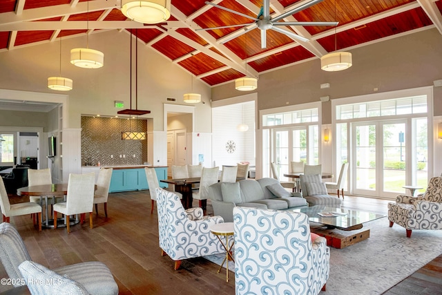 living room with ceiling fan, high vaulted ceiling, dark wood-type flooring, wood ceiling, and beamed ceiling