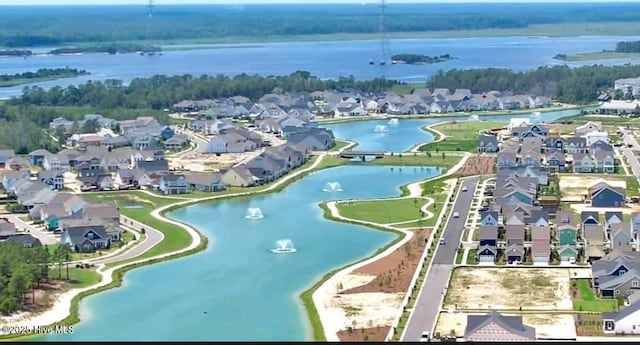 bird's eye view with a residential view and a water view