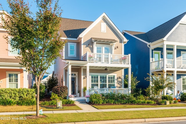 view of front of home with covered porch and a balcony