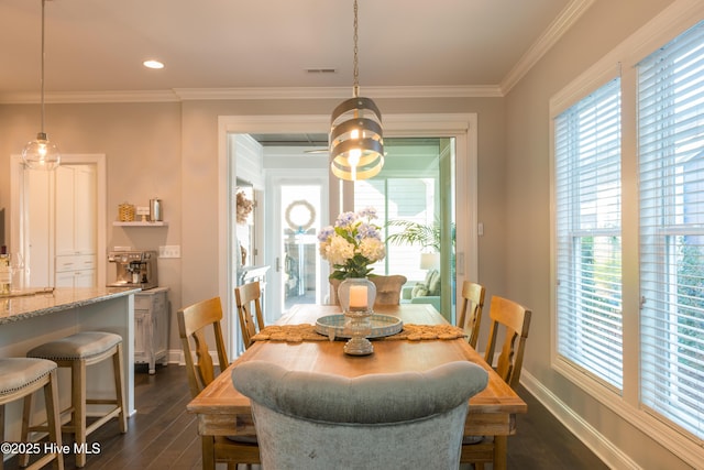 dining room featuring recessed lighting, dark wood-style flooring, visible vents, baseboards, and ornamental molding