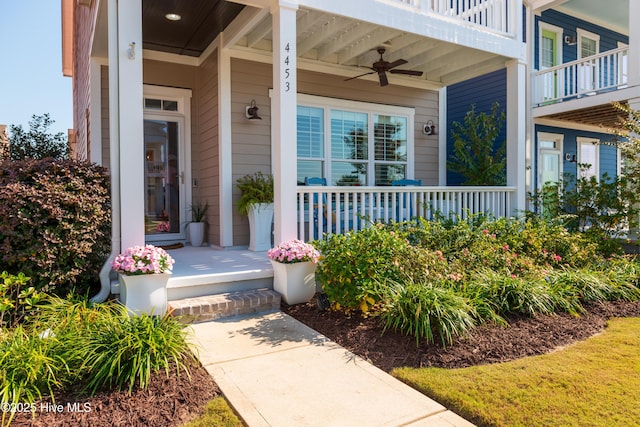 property entrance with covered porch and a ceiling fan