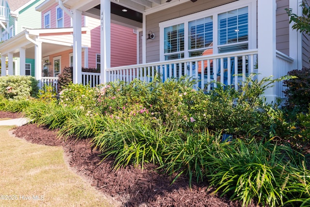 view of property exterior with covered porch