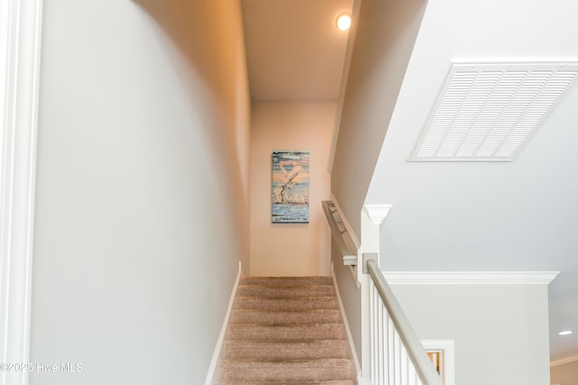 stairway with recessed lighting and baseboards