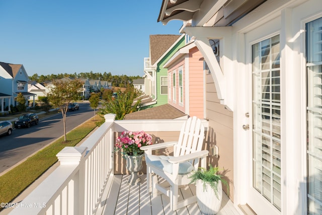 balcony featuring a residential view and french doors