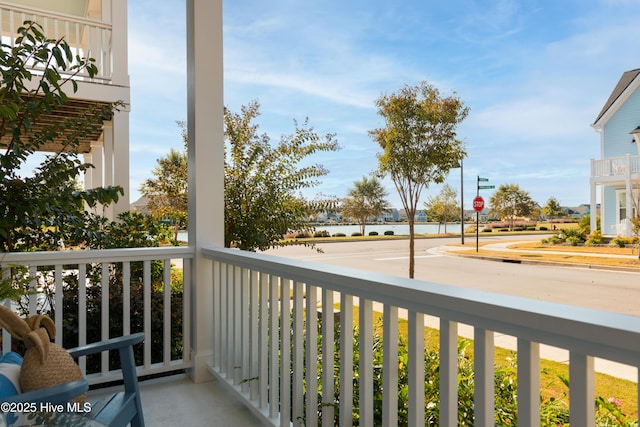 balcony featuring a water view