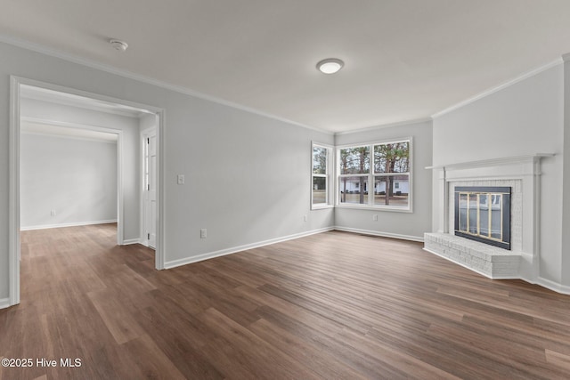 unfurnished living room featuring dark hardwood / wood-style floors, a brick fireplace, and ornamental molding