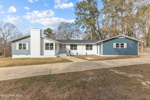 ranch-style house with a front lawn