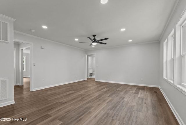 spare room featuring hardwood / wood-style flooring, ceiling fan, and crown molding