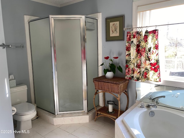 bathroom featuring plus walk in shower, tile patterned flooring, toilet, and plenty of natural light