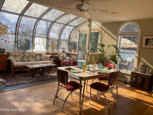 sunroom / solarium with ceiling fan